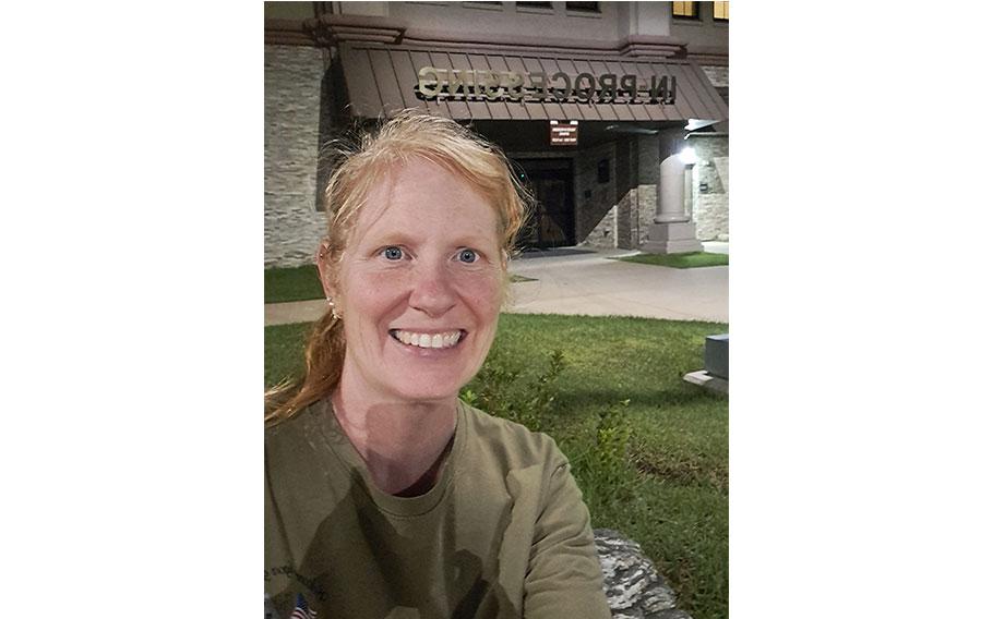 Kelly Karwel poses in front of the in-pocessing building.