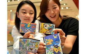 Two women are showing Pokémon cards.