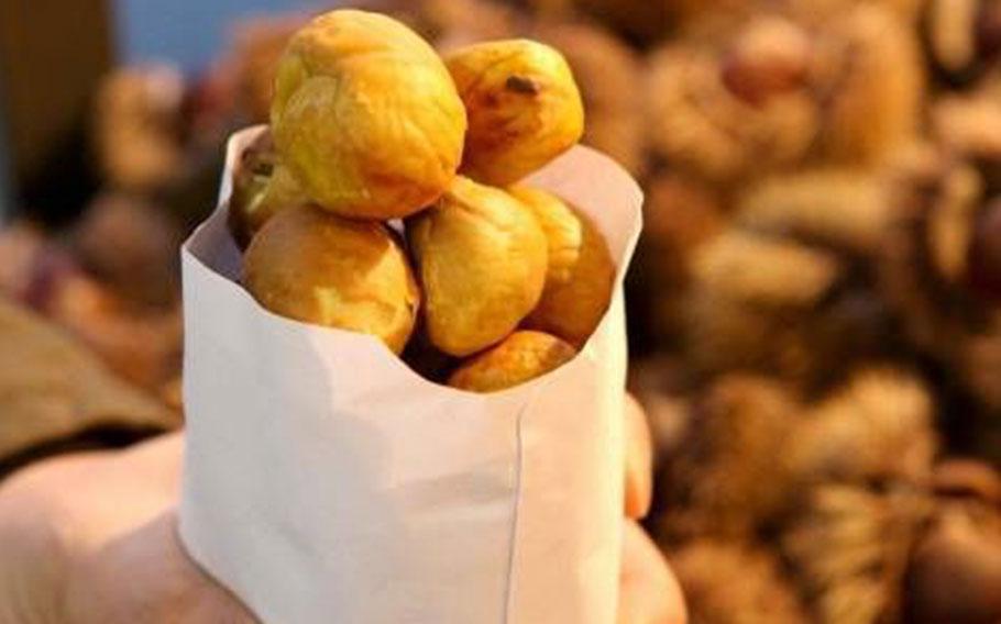 Baked chestnuts in a paper bag.