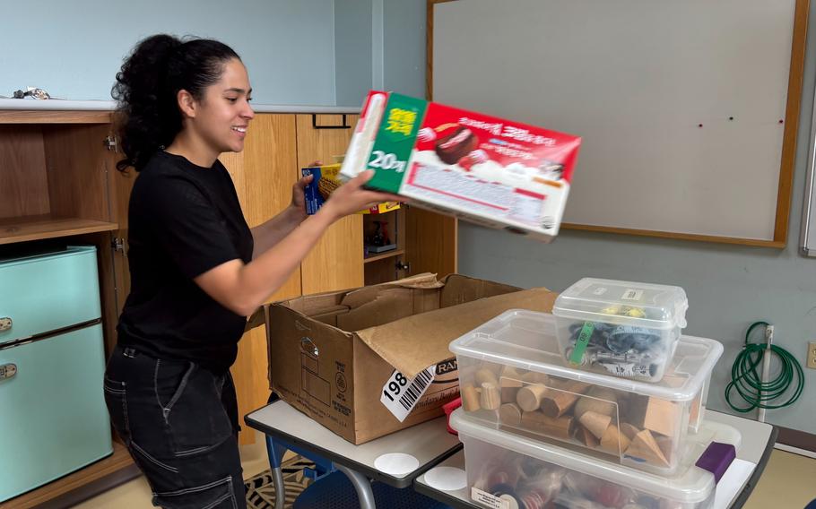 SPC Martha Angely Vargas (U.S. Army, Delta Co. 125th FI BN) loading boxes for classroom move.