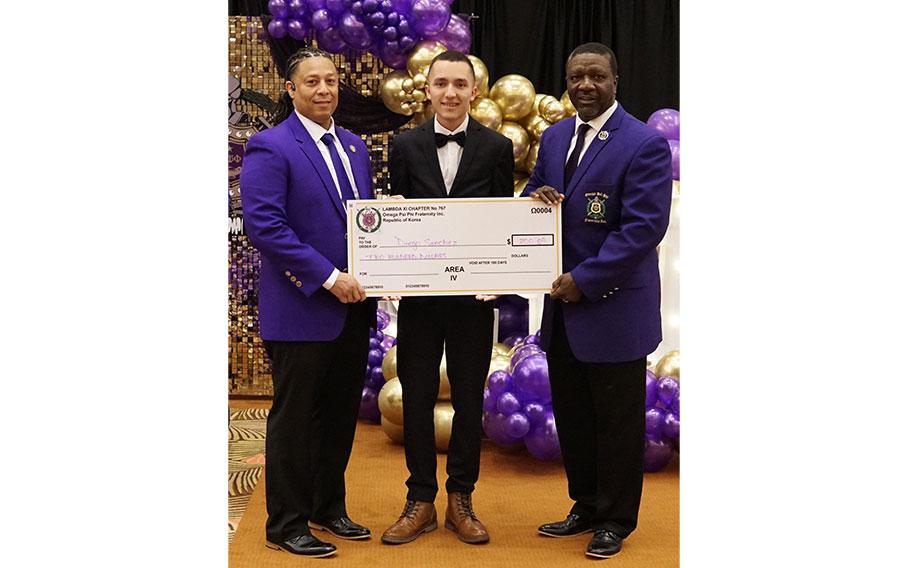 3rd Place Winner – Diego Sanchez-Rivera from Humphreys High School receives a $200 check from the Brothers of Lambda Xi Chapter of Omega Psi Phi Fraternity, Inc.