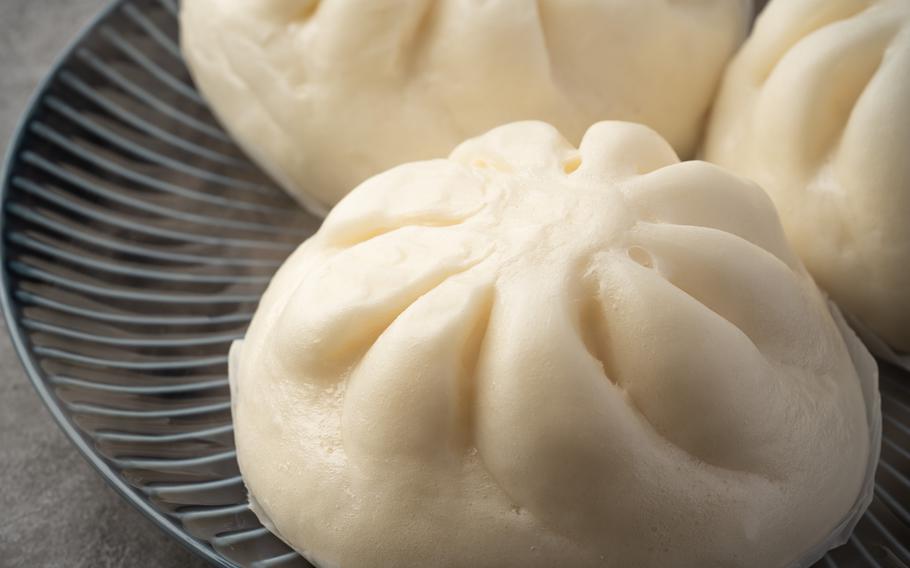 Three hot Wangmandu on a dish.