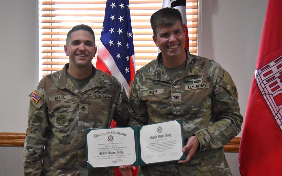 Col. Jeremiah Willis and Staff Sgt. Cullen Ellis pose for a photo.