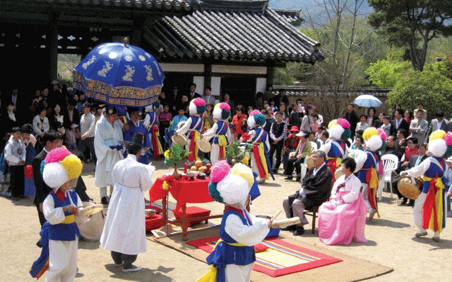 A ceremony held in front of the traditional building.