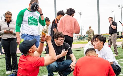 Photo Of Army Emergency Relief Chief Executive Officer Tony Grinston and U.S. Army Soldiers participate in a “Squid Game” event held by AER on Camp Humphreys, South Korea, May 19, 2025. AER held several events over the course of two days to spread awareness about AER’s programs for Soldiers. 