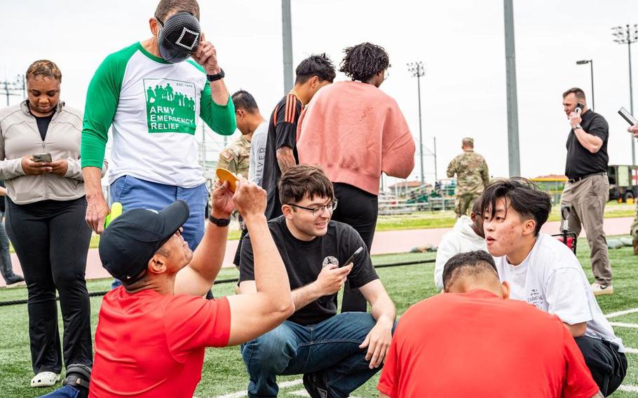 Army Emergency Relief Chief Executive Officer Tony Grinston and U.S. Army Soldiers participate in a “Squid Game” event held by AER on Camp Humphreys, South Korea, May 19, 2025. AER held several events over the course of two days to spread awareness about AER’s programs for Soldiers. 