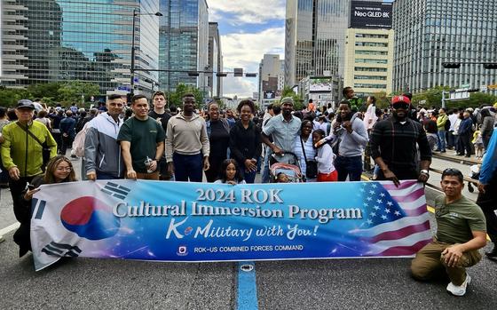 participants pose on the road.