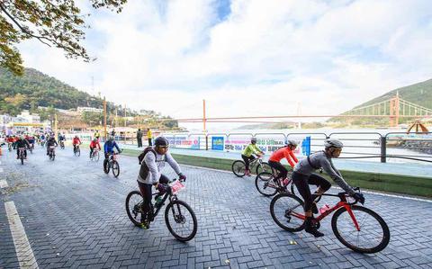 Photo Of Participants for the race are riding a bike.