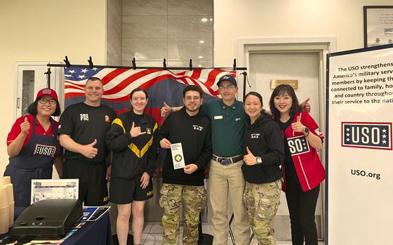 USO staff members pose for a photo.