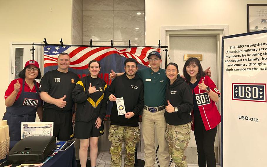 USO staff members pose for a photo.
