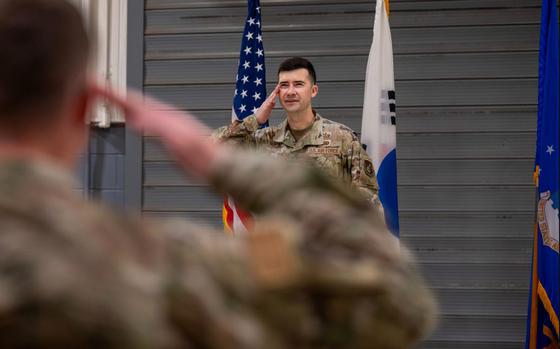 U.S. Air Force Maj. James Phillips, incoming 51st Munitions Squadron commander, renders his first salute during a Change of Command ceremony at Osan Air Base.