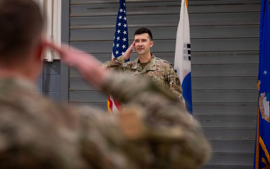 U.S. Air Force Maj. James Phillips, incoming 51st Munitions Squadron commander, renders his first salute during a Change of Command ceremony at Osan Air Base.