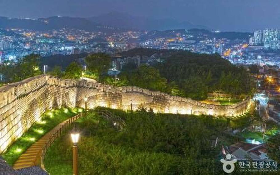 A path in Naksan Park lights up.