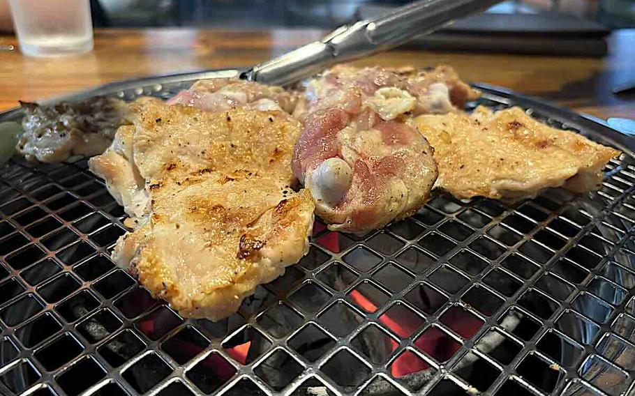 Chicken is being grilled.