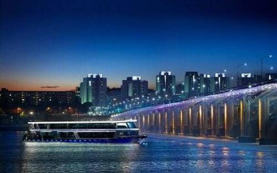 A cruiser is about to sail under the bridge.
