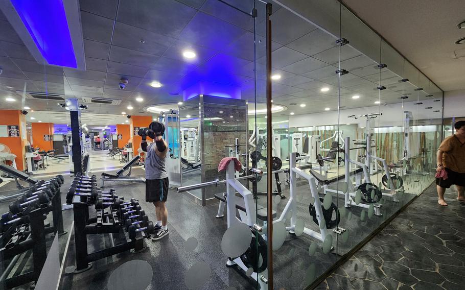 a man enjoying weightlifting in a gym.