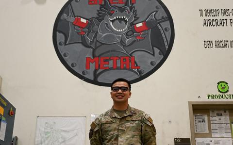 Photo Of U.S. Air Force Tech. Sgt. Timothy Abian poses for a photo in the fabrication flight building at Kunsan Air Base.