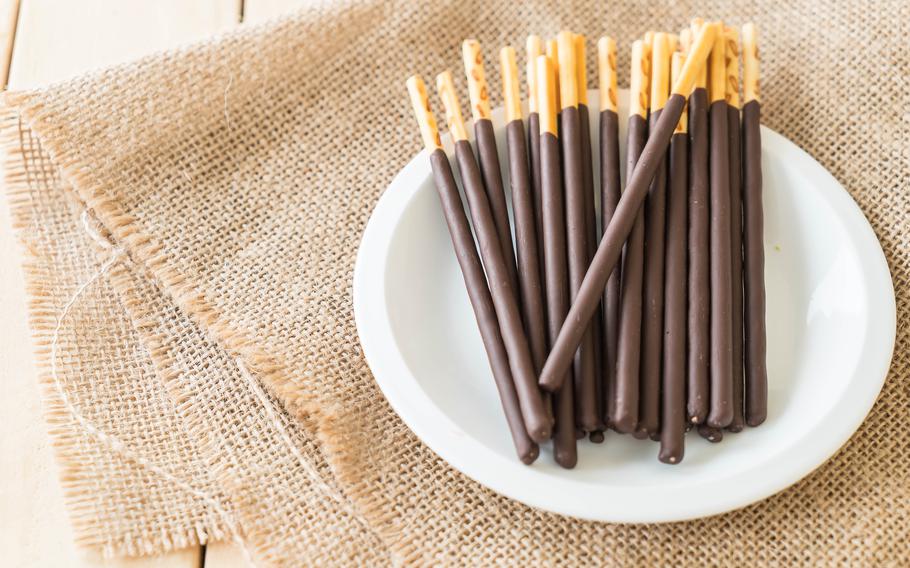 thin cookie sticks on the dish