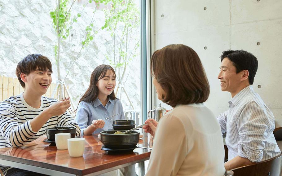 a family enjoying the meal.