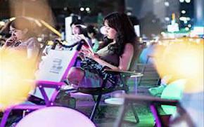 Visitors are enjoying reading books outside.