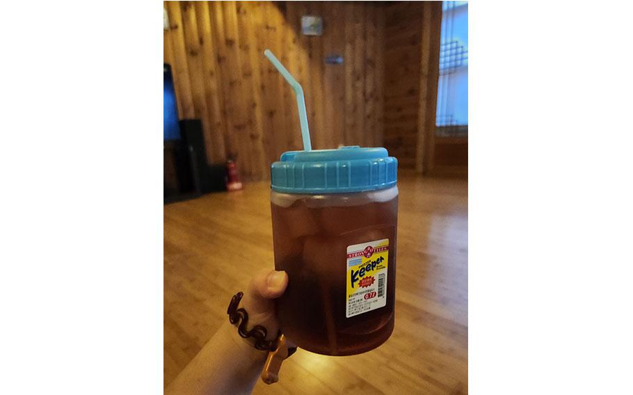 a person holding traditional cold drink.