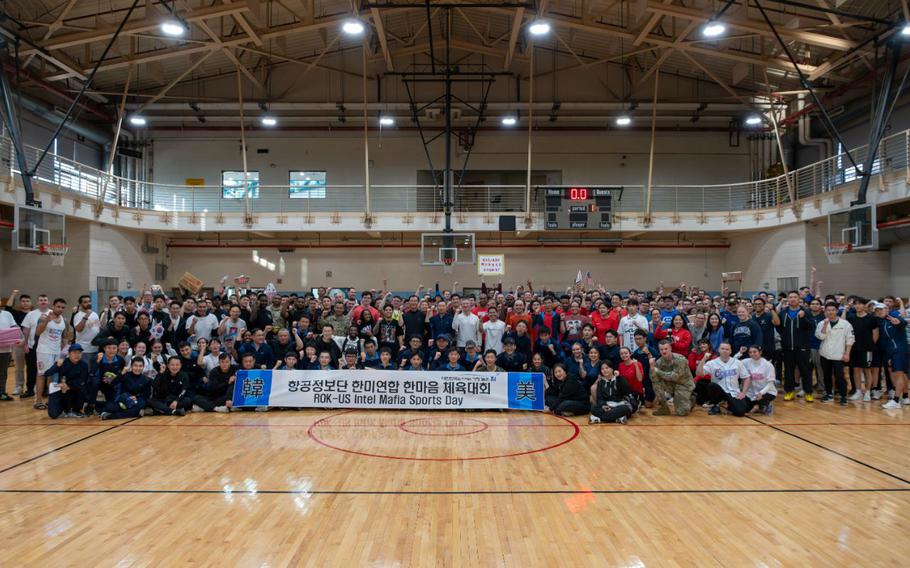 U.S. Air Force and Republic of Korea Air Force members pose for a group photo in the gym.