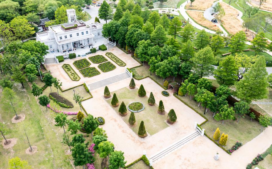 An aerial photograph of French Garden. Well-arranged trees are in the garden.