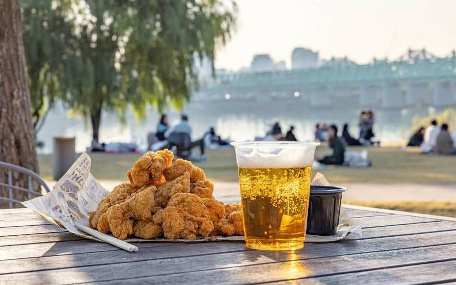 fried chicken and beer on the table.