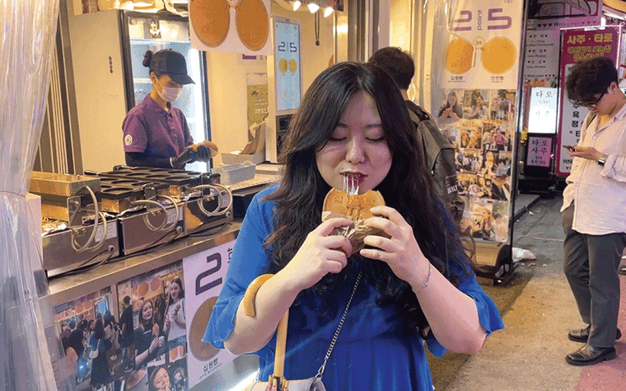 Hyemin enjoys a 10-won Cheese Bread.