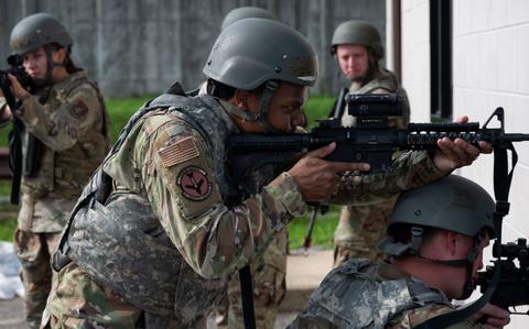 Photo Of Senior Airman Javian Jones holds position during the ability to survive and operate training at Osan Air Base.