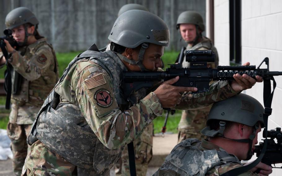 Senior Airman Javian Jones holds position during the ability to survive and operate training at Osan Air Base.