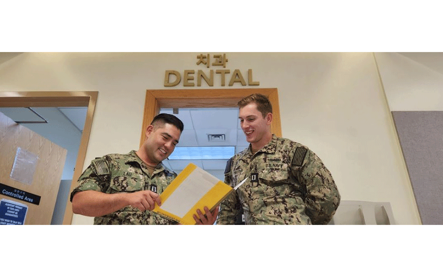 Lieutenant Ryan Twaddle (right), Branch Health Clinic (BHC) dentist aboard Fleet Activities Chinhae (CFAC), consults with Lt. Jensen Lau, a reserve dentist from 4th Dental Battalion out of Houston, on Aug. 22. Twaddle, who recently arrived here, will attend to the dental needs of Navy Region Korea that was without a full-time dentist in a long time.