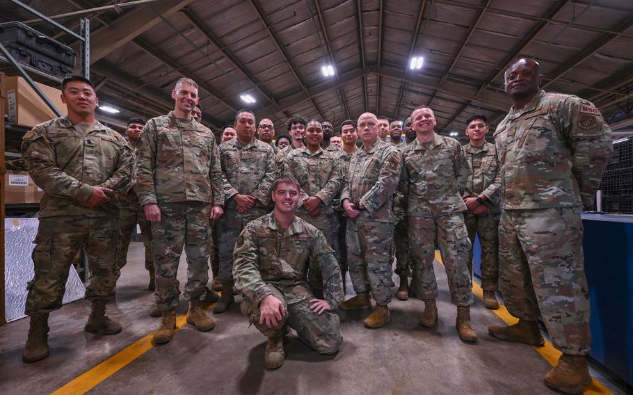 Airmen from the 8th Logistics Readiness Squadron gather for a group photo with 8th Fighter Wing and 8th Mission Support Group leadership following a recognition ceremony at Kunsan Air Base, Republic of Korea, Oct. 6, 2023. The 8th LRS was commended by 8th FW leadership for their efforts during Operation Pack Up and a warehouse realignment that repurposed 7,000 individual protection equipment assets for training gear. 