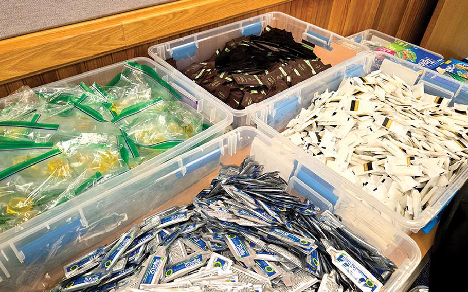 Some of the items for the welcome kits are in containers.