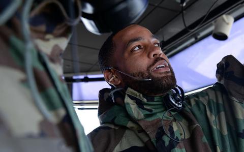 Photo Of A full close-up photo of Technical Sgt. James Samuel Jr. inside an aircraft.