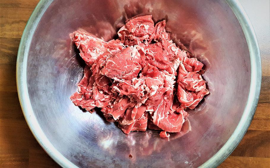 cut meat in a food container.