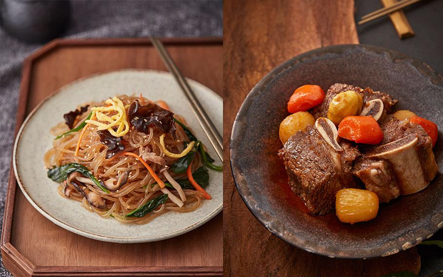 Japchae and Galbijjim are on plates.