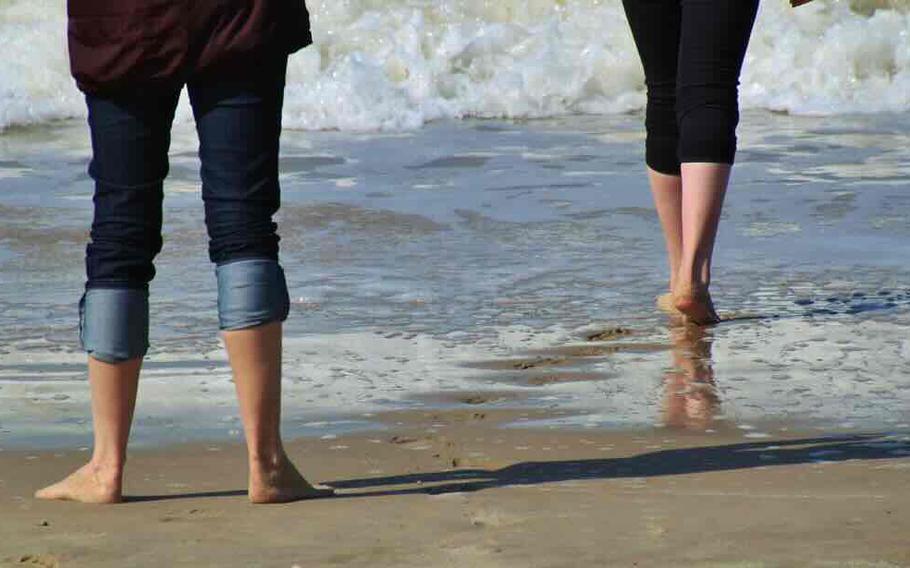 Two people are enjoying on the beach.
