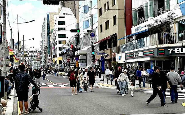 People are walking the car-free cultural street.