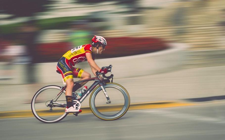 A man riding a race bike.