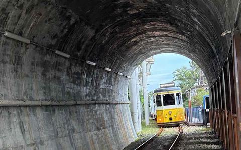 Photo Of A train is about to pass a tunnel.