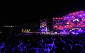 Audience enjoys a concert.