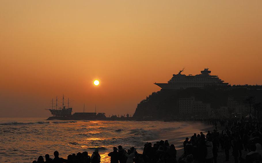 people enjoying the sunrise on Jeongdongjin-Beach.