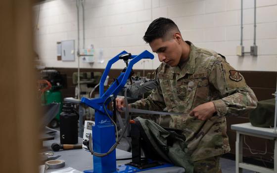 U.S. Air Force Senior Airman Keven Gomescoello, 51st Operations Support Squadron aircrew flight equipment technician, applies seam tape to an anti-exposure suit at Osan Air Base, Republic of Korea, May 22, 2025. Suit maintenance ensures pilots remain protected during over-water operations, which are common in the Indo-Pacific region. 