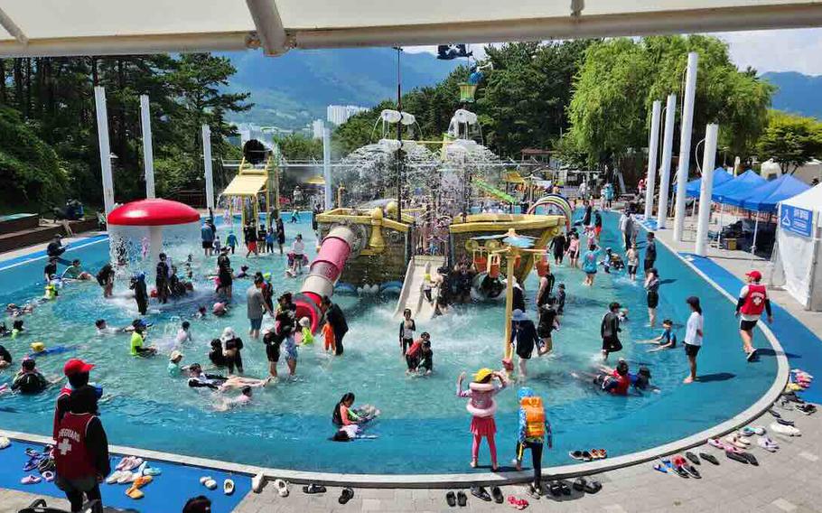 Visitors are enjoying one of the pools in the park.