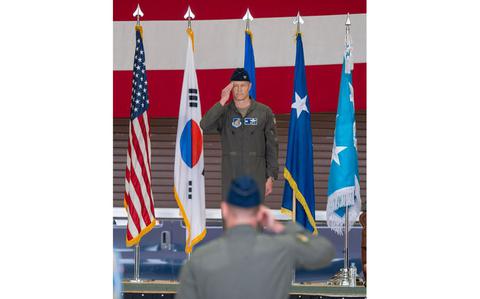Photo Of U.S. Air Force Col. Ryan Ley renders his first salute.