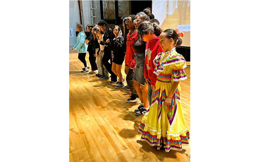 Students participating in Humphreys Middle School Hispanic Heritage Month Program led the Cha Cha Cha Dance.