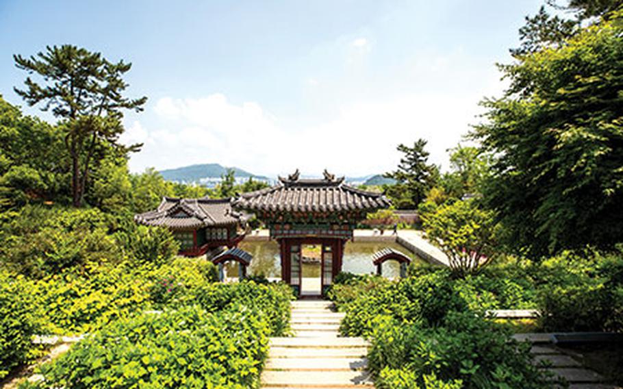 There is a traditional gate beyond the walkway.