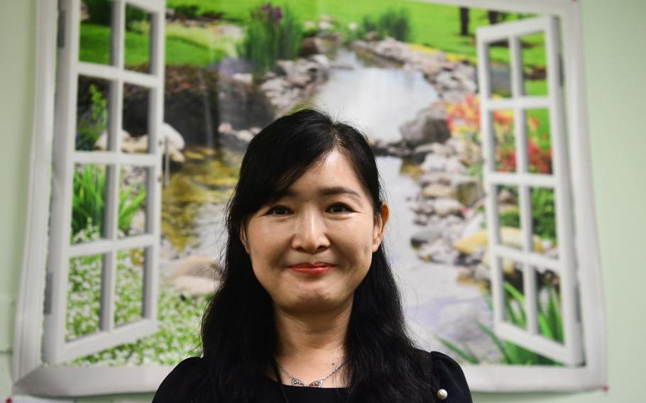 Huichong No, 8th Medical Group quality, risk, credentials manager, stands in her office at Kunsan Air Base, Republic of Korea, Aug. 1, 2022. No is responsible for overseeing accreditation and compliance programs for the 8th MDG. (U.S. Air Force photo by Staff Sgt. Isaiah J. Soliz)