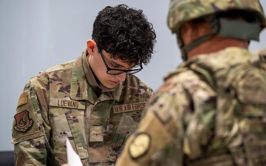 U.S. Air Force Airman Kevin Luevano, 51st Force Support Squadron personnel, processes a Korean Service Corps Pyeongtaek Mobilization Station member during a simulated contingency operations training at Osan Air Base, Republic of Korea, Dec. 5, 2024. 